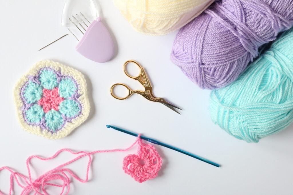 African Flower crochet with scissors, dk yarn and darning needles.