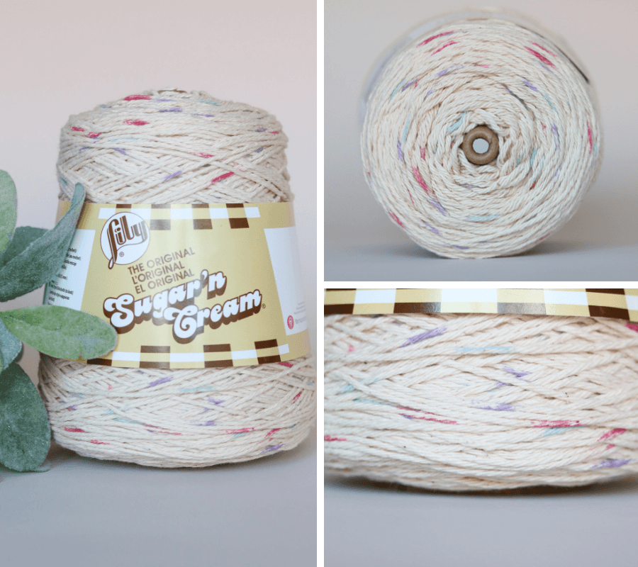 Sugar n' cream yarn in a cone next to a plant.